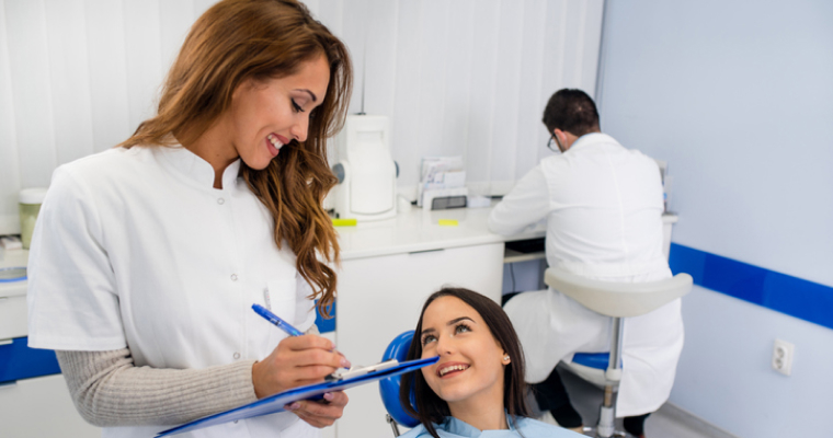 Dental hygienist speaking with a patient